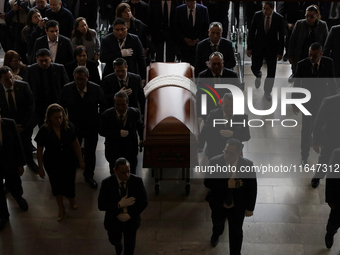 Funeral home staff carry the coffin of Ifigenia Martinez, President of the Chamber of Deputies, in Mexico City, Mexico, on October 7, 2024....