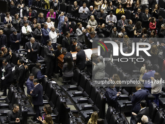 Funeral home staff carry the coffin of Ifigenia Martinez, President of the Chamber of Deputies, in Mexico City, Mexico, on October 7, 2024....