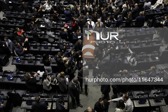 Funeral home staff carry the coffin of Ifigenia Martinez, President of the Chamber of Deputies, in Mexico City, Mexico, on October 7, 2024....