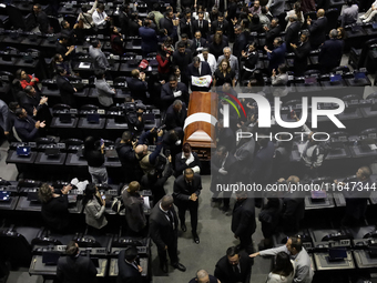 Funeral home staff carry the coffin of Ifigenia Martinez, President of the Chamber of Deputies, in Mexico City, Mexico, on October 7, 2024....