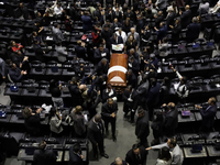 Funeral home staff carry the coffin of Ifigenia Martinez, President of the Chamber of Deputies, in Mexico City, Mexico, on October 7, 2024....