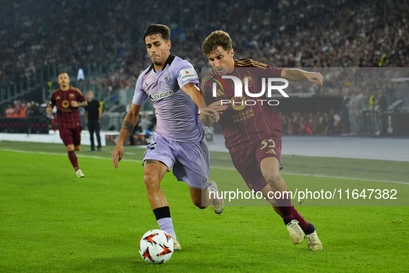 Tommaso Baldanzi attacking midfield of Roma and Italy and Beñat Prados central midfield of Athletic Club and Spain compete for the ball duri...