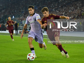 Tommaso Baldanzi attacking midfield of Roma and Italy and Beñat Prados central midfield of Athletic Club and Spain compete for the ball duri...