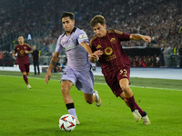 Tommaso Baldanzi attacking midfield of Roma and Italy and Beñat Prados central midfield of Athletic Club and Spain compete for the ball duri...