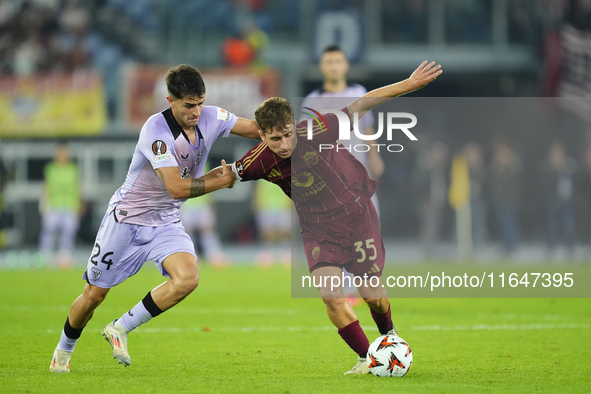 Tommaso Baldanzi attacking midfield of Roma and Italy and Beñat Prados central midfield of Athletic Club and Spain compete for the ball duri...