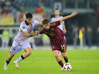 Tommaso Baldanzi attacking midfield of Roma and Italy and Beñat Prados central midfield of Athletic Club and Spain compete for the ball duri...