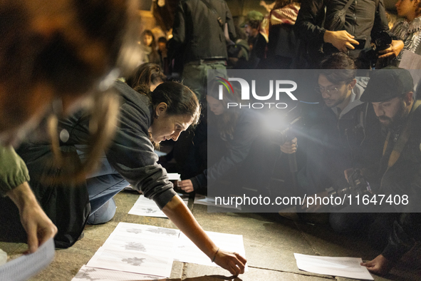 Pro-Palestinian demonstrators in Turin, Italy, project the names of all those killed in Israeli military actions in the Gaza Strip onto the...