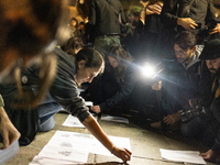 Pro-Palestinian demonstrators in Turin, Italy, project the names of all those killed in Israeli military actions in the Gaza Strip onto the...