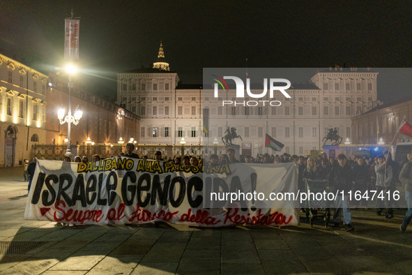 Pro-Palestinian protesters participate in demonstrations in Turin, Italy, on October 7, 2024. Despite restrictions issued by local police fo...