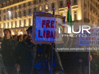 Pro-Palestinian protesters participate in demonstrations in Turin, Italy, on October 7, 2024. Despite restrictions issued by local police fo...