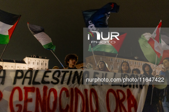 Pro-Palestinian protesters participate in demonstrations in Turin, Italy, on October 7, 2024. Despite restrictions issued by local police fo...