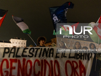 Pro-Palestinian protesters participate in demonstrations in Turin, Italy, on October 7, 2024. Despite restrictions issued by local police fo...