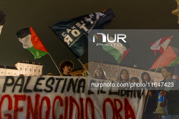 Pro-Palestinian protesters participate in demonstrations in Turin, Italy, on October 7, 2024. Despite restrictions issued by local police fo...