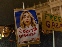 Pro-Palestinian protesters hold up a sign protesting against Prime Minister Meloni during demonstrations in Turin, Italy, on October 7, 2024...