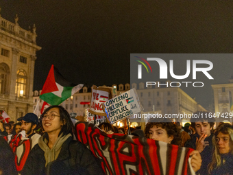 Pro-Palestinian protesters participate in demonstrations in Turin, Italy, on October 7, 2024. Despite restrictions issued by local police fo...