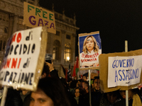 Pro-Palestinian protesters hold up a sign protesting against Prime Minister Meloni during demonstrations in Turin, Italy, on October 7, 2024...