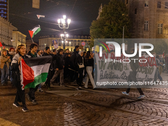 Pro-Palestinian protesters participate in demonstrations in Turin, Italy, on October 7, 2024. Despite restrictions issued by local police fo...