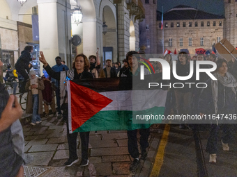 Pro-Palestinian protesters participate in demonstrations in Turin, Italy, on October 7, 2024. Despite restrictions issued by local police fo...