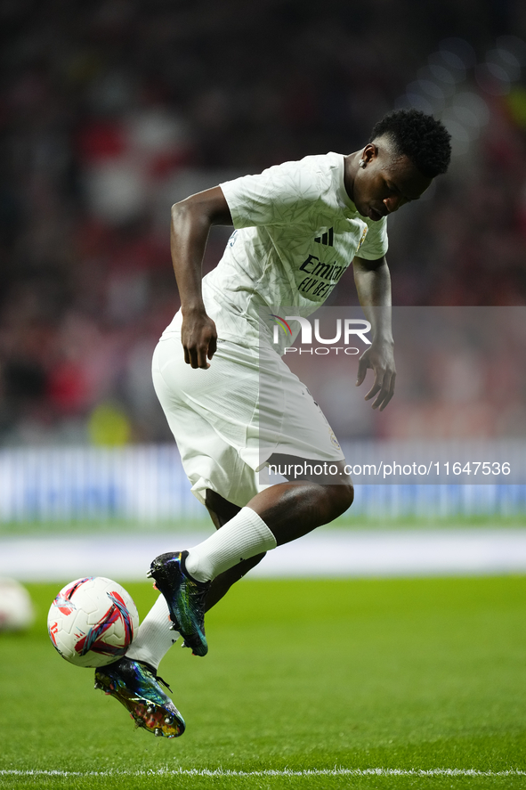 Vinicius Junior left winger of Real Madrid and Brazil during the warm-up before the LaLiga match between Atletico de Madrid and Real Madrid...