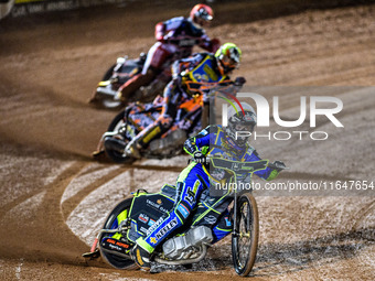 Nathan Ablitt of the Sheffield Cubs in White leads Mickie Simpson of the Sheffield Cubs in Yellow and Sam Hagon of the Belle Vue Colts in Re...