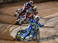 Nathan Ablitt of the Sheffield Cubs in White leads Mickie Simpson of the Sheffield Cubs in Yellow and Sam Hagon of the Belle Vue Colts in Re...