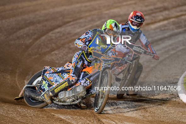 Sheffield Cubs' Mickie Simpson in Yellow leads Belle Vue Colts' Sam Hagon in Red during the WSRA National Development League match between B...