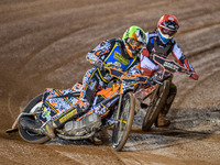 Sheffield Cubs' Mickie Simpson in Yellow leads Belle Vue Colts' Sam Hagon in Red during the WSRA National Development League match between B...