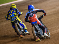 Jamie Etherington of the Sheffield Cubs in Yellow passes Harry McGurk of the Belle Vue Colts in Blue on the inside during the WSRA National...