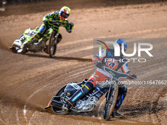 Matt Marson of Belle Vue Colts in blue leads Ace Pijper of Sheffield Cubs in yellow during the WSRA National Development League match betwee...