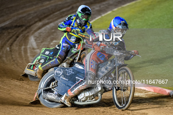 Harry McGurk of Belle Vue Colts in blue leads Luke Harrison of Sheffield Cubs in white during the WSRA National Development League match bet...