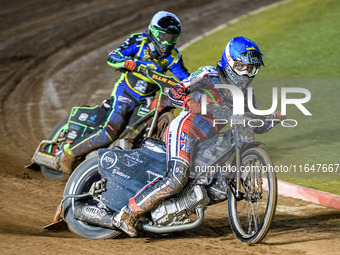 Harry McGurk of Belle Vue Colts in blue leads Luke Harrison of Sheffield Cubs in white during the WSRA National Development League match bet...