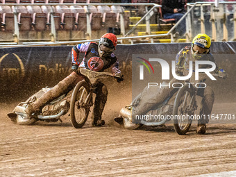 Belle Vue Colts' Matt Marson in red rides outside Sheffield Cubs' Jamie Etherington in yellow during the WSRA National Development League ma...