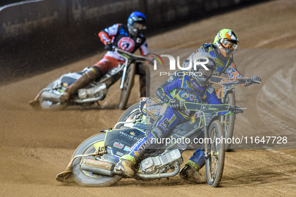 Nathan Ablitt of the Sheffield Cubs in White leads Mickie Simpson of the Sheffield Cubs in Yellow and Matt Marson of the Belle Vue Colts in...