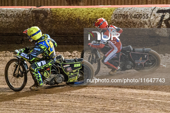 Sheffield Cubs' Ace Pijper rides inside Belle Vue Colts' Sam Hagon in red during the WSRA National Development League match between Belle Vu...