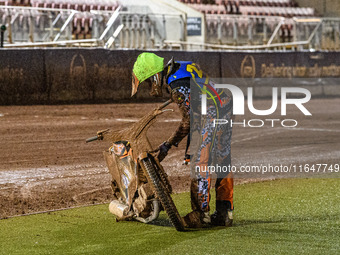 Mickie Simpson of the Sheffield Cubs checks his bike after his mechanical retirement during the WSRA National Development League match betwe...