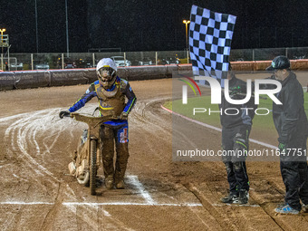 Sheffield Cubs' Nathan Ablitt crosses the finish line after pushing his bike for half a lap of the 380-meter track during the WSRA National...