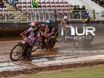 Belle Vue Colts' guest rider Jake Mulford in red leads Belle Vue Colts' Chad Wirtzfeld in blue, Sheffield Cubs' Kean Dicken in yellow, and S...