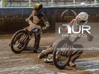 Sheffield Cubs' Stene Pijper in white rides inside Sheffield Cubs' Kean Dicken in yellow during the WSRA National Development League match b...