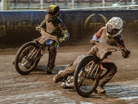 Sheffield Cubs' Stene Pijper in white rides inside Sheffield Cubs' Kean Dicken in yellow during the WSRA National Development League match b...