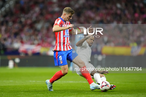 Alexander Sorloth centre-forward of Atletico de Madrid and Norway and Eder Militao centre-back of Real Madrid and Brazil compete for the bal...