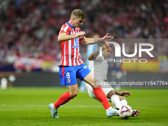 Alexander Sorloth centre-forward of Atletico de Madrid and Norway and Eder Militao centre-back of Real Madrid and Brazil compete for the bal...