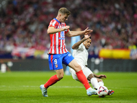 Alexander Sorloth centre-forward of Atletico de Madrid and Norway and Eder Militao centre-back of Real Madrid and Brazil compete for the bal...