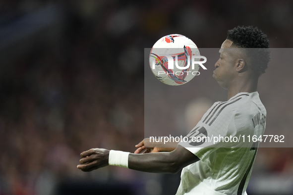 Vinicius Junior left winger of Real Madrid and Brazil controls the ball during the LaLiga match between Atletico de Madrid and Real Madrid C...