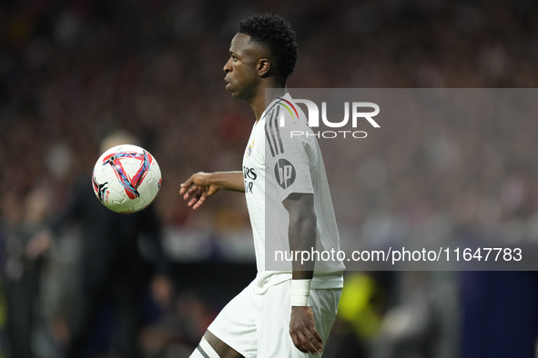 Vinicius Junior left winger of Real Madrid and Brazil controls the ball during the LaLiga match between Atletico de Madrid and Real Madrid C...