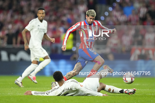 Jude Bellingham central midfield of Real Madrid and England and Rodrigo de Paul central midfield of Atletico de Madrid and Argentina compete...