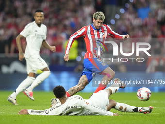 Jude Bellingham central midfield of Real Madrid and England and Rodrigo de Paul central midfield of Atletico de Madrid and Argentina compete...