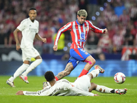 Jude Bellingham central midfield of Real Madrid and England and Rodrigo de Paul central midfield of Atletico de Madrid and Argentina compete...