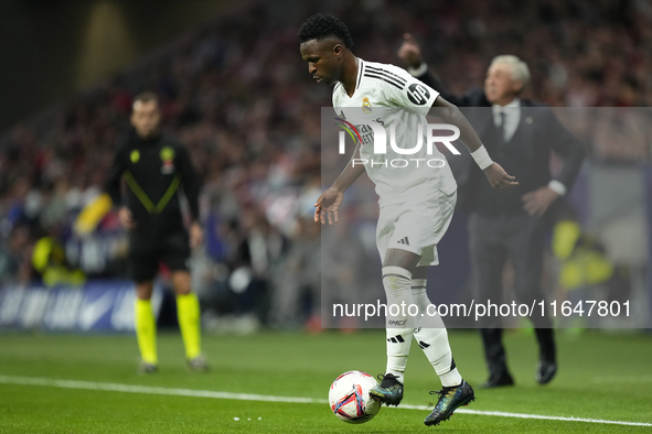 Vinicius Junior left winger of Real Madrid and Brazil controls the ball during the LaLiga match between Atletico de Madrid and Real Madrid C...