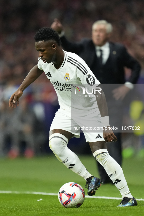 Vinicius Junior left winger of Real Madrid and Brazil controls the ball during the LaLiga match between Atletico de Madrid and Real Madrid C...