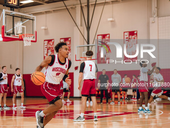 Wisconsin Badgers guard John Tonje #9 runs a drill during practice at the Nicholas Johnson Pavilion in Madison, WI, on October 7, 2024. (